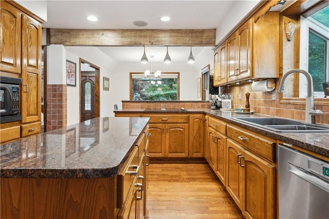 4710 Monrovia St, Shawnee, KS 66216 - kitchen featuring dishwasher, black microwave, healthy amount of natural light, beamed ceiling, and light wood-style floors