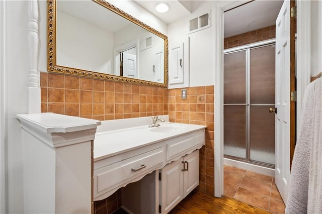 4710 Monrovia St, Shawnee, KS 66216 - full bathroom featuring tile walls, vanity, and a stall shower