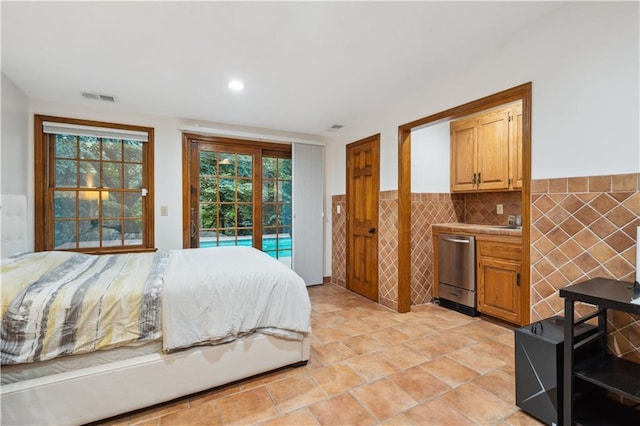 4710 Monrovia St, Shawnee, KS 66216 - bedroom with access to exterior, tile walls, multiple windows, recessed lighting, and wainscoting