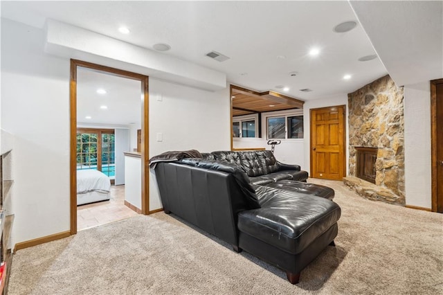 4710 Monrovia St, Shawnee, KS 66216 - living room with recessed lighting, light colored carpet, and a stone fireplace