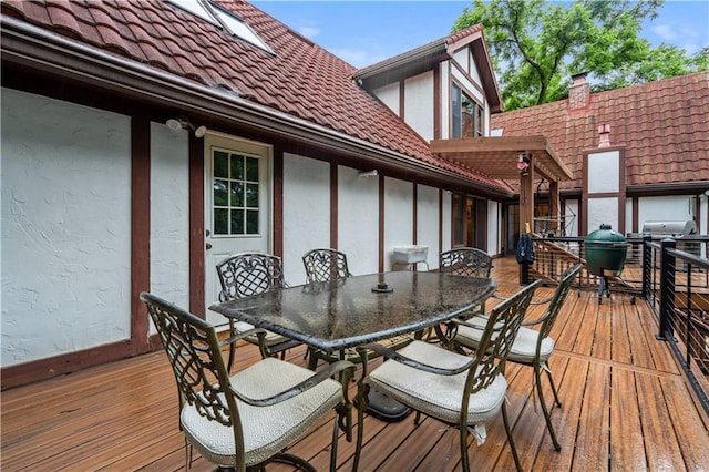 4710 Monrovia St, Shawnee, KS 66216 - wooden deck with outdoor dining area and area for grilling