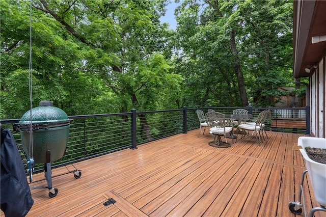 4710 Monrovia St, Shawnee, KS 66216 - wooden terrace featuring outdoor dining area