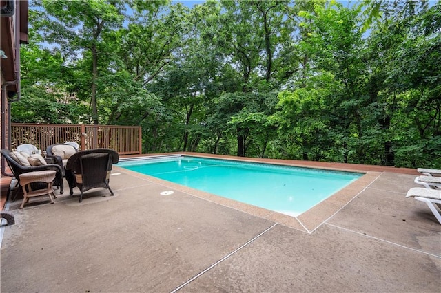 4710 Monrovia St, Shawnee, KS 66216 - outdoor pool with view of scattered trees and a patio area