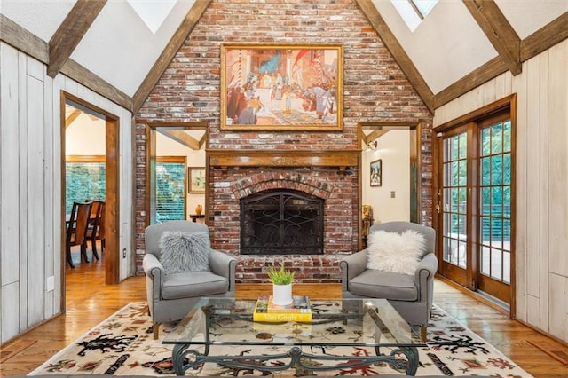 4710 Monrovia St, Shawnee, KS 66216 - living room featuring a skylight, high vaulted ceiling, beam ceiling, a fireplace, and wood finished floors