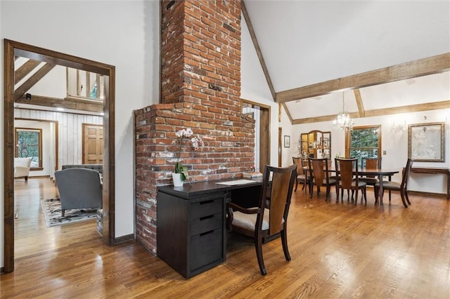 4710 Monrovia St, Shawnee, KS 66216 - dining room with high vaulted ceiling, a chandelier, wood finished floors, and beamed ceiling