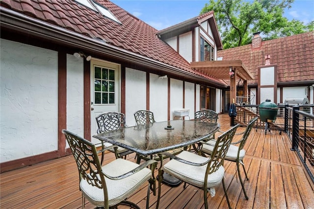 4710 Monrovia St, Shawnee, KS 66216 - wooden deck with outdoor dining area and a grill