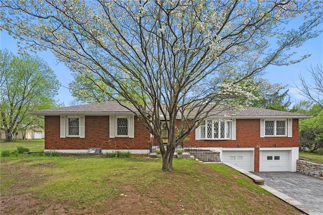 8416 Westridge Rd, Raytown, MO 64138 - single story home featuring driveway, a front yard, brick siding, and a garage