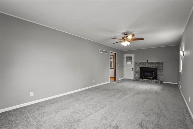 8416 Westridge Rd, Raytown, MO 64138 - unfurnished living room featuring ceiling fan, visible vents, baseboards, a brick fireplace, and carpet