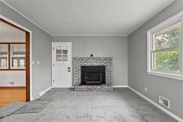 8416 Westridge Rd, Raytown, MO 64138 - unfurnished living room with visible vents, crown molding, carpet flooring, and baseboards