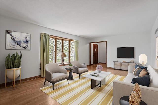 8416 Westridge Rd, Raytown, MO 64138 - living area featuring wood finished floors and baseboards