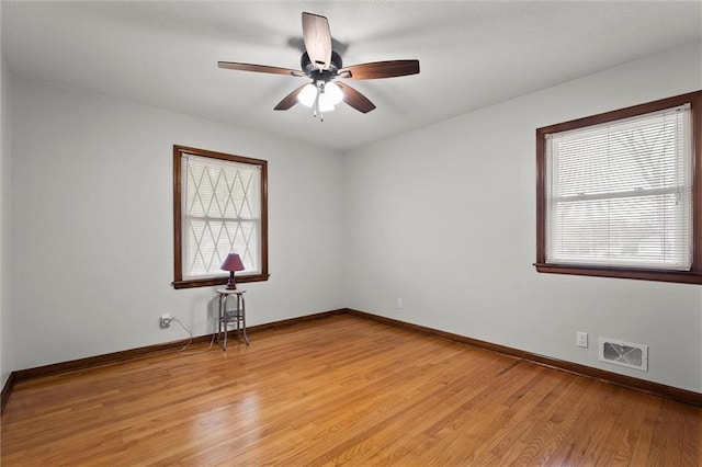 8416 Westridge Rd, Raytown, MO 64138 - empty room with ceiling fan, visible vents, light wood-type flooring, and baseboards