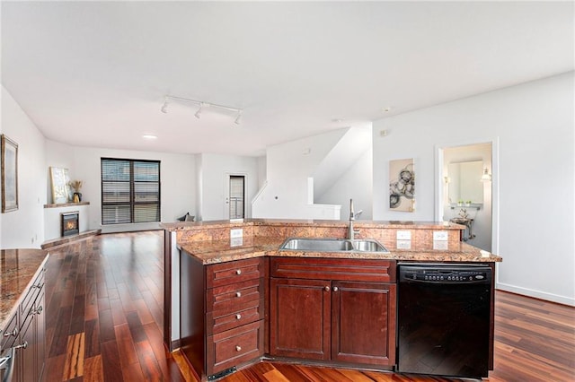 4581 Madison Ave, Kansas City, MO 64111 - kitchen featuring dishwasher, a sink, open floor plan, and dark wood-style floors