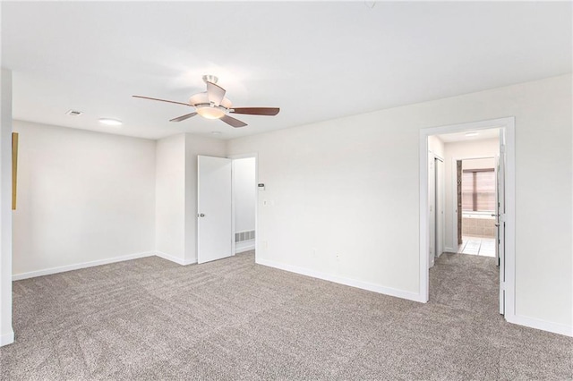 4581 Madison Ave, Kansas City, MO 64111 - unfurnished room featuring carpet, ceiling fan, and baseboards