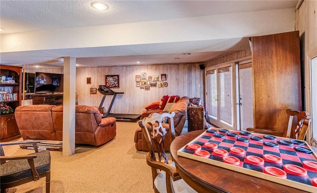 521 W Sugar Lake Dr, Mound City, KS 66056 - living room with carpet flooring, wood walls, and a textured ceiling