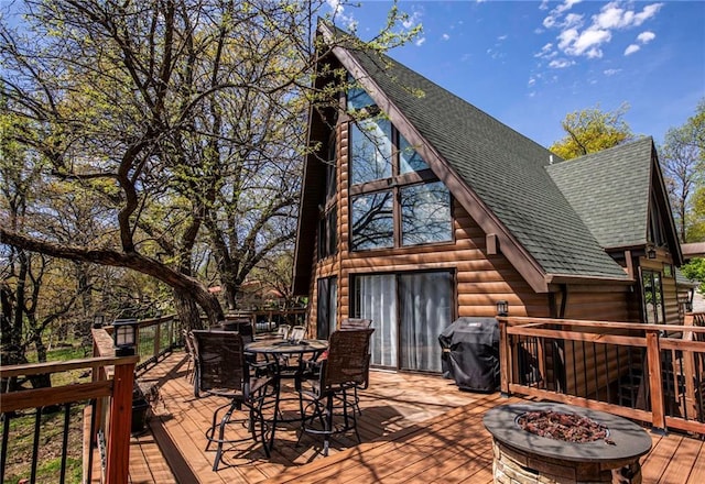 521 W Sugar Lake Dr, Mound City, KS 66056 - deck featuring outdoor dining space, an outdoor fire pit, and area for grilling