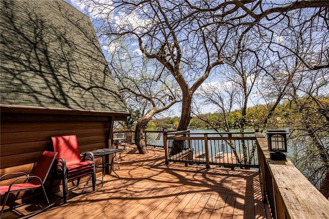 521 W Sugar Lake Dr, Mound City, KS 66056 - wooden terrace featuring a water view