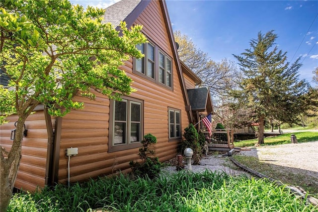 521 W Sugar Lake Dr, Mound City, KS 66056 - view of side of home featuring a shingled roof