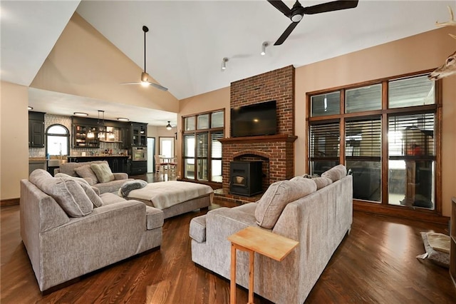 4353 NW State Route Ff, Adrian, MO 64720 - living area featuring a ceiling fan, high vaulted ceiling, and dark wood-type flooring