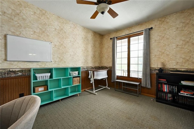 4353 NW State Route Ff, Adrian, MO 64720 - interior space featuring carpet floors, a wainscoted wall, and ceiling fan