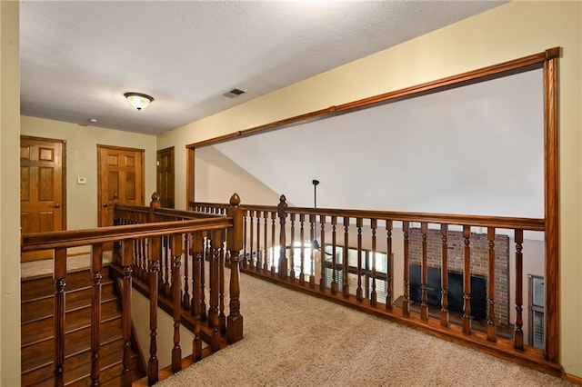 4353 NW State Route Ff, Adrian, MO 64720 - hall featuring an upstairs landing, visible vents, and carpet
