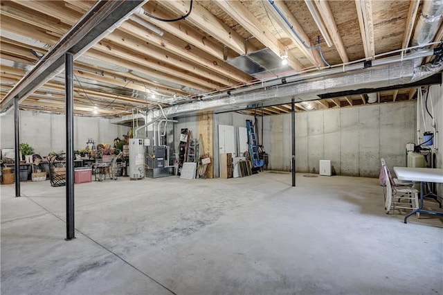 unfinished below grade area featuring gas water heater
