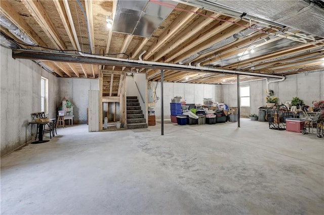 basement with stairs and electric panel