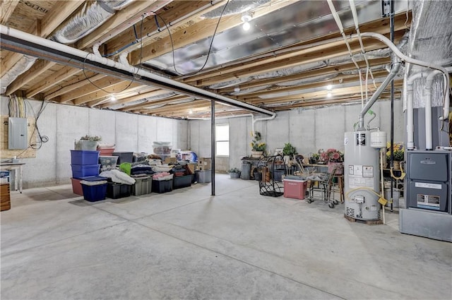 below grade area featuring gas water heater and electric panel