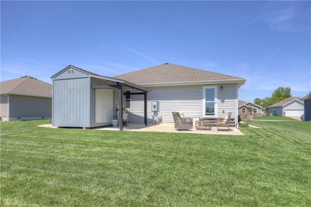 rear view of house with a lawn, an outdoor hangout area, a patio area, and a storage shed
