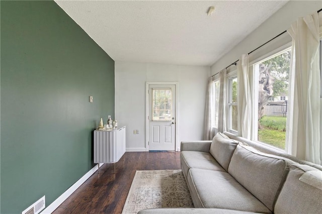 2014 W 74th St, Prairie Village, KS 66208 - living room featuring baseboards, plenty of natural light, and wood finished floors