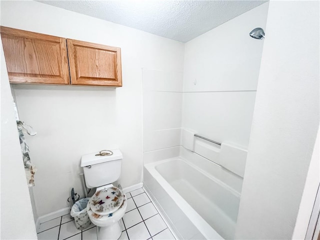 628 S Clay St, Nevada, MO 64772 - full bathroom featuring tile patterned flooring, toilet, baseboards, a textured ceiling, and shower / bath combination