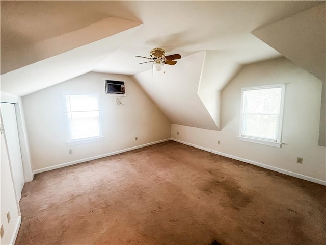 628 S Clay St, Nevada, MO 64772 - bonus room with baseboards, carpet flooring, ceiling fan, and vaulted ceiling