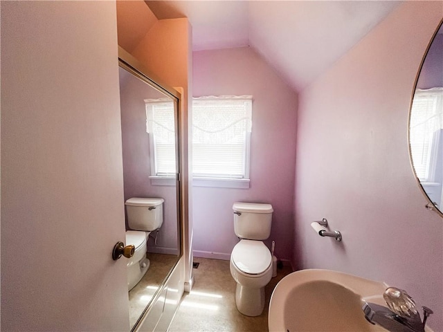 628 S Clay St, Nevada, MO 64772 - bathroom with a shower with shower door, toilet, and lofted ceiling