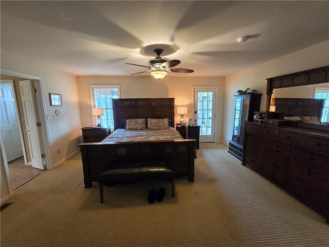 1502 Hillcrest Ct, Atchison, KS 66002 - bedroom featuring light carpet, baseboards, and a ceiling fan