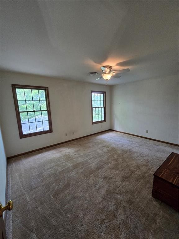 1502 Hillcrest Ct, Atchison, KS 66002 - carpeted empty room featuring a ceiling fan and baseboards