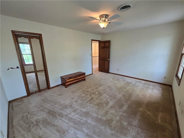 1502 Hillcrest Ct, Atchison, KS 66002 - spare room with a ceiling fan, baseboards, and carpet