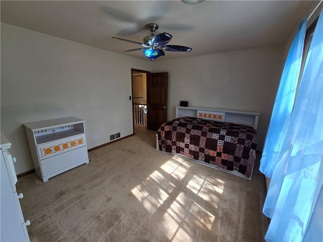 1502 Hillcrest Ct, Atchison, KS 66002 - bedroom featuring carpet, ceiling fan, and baseboards