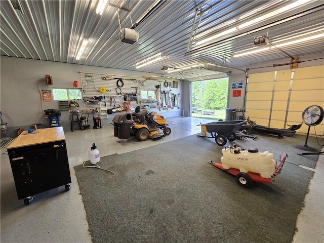 1502 Hillcrest Ct, Atchison, KS 66002 - garage featuring a garage door opener and a workshop area
