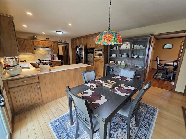1502 Hillcrest Ct, Atchison, KS 66002 - dining space with light wood-style flooring and recessed lighting
