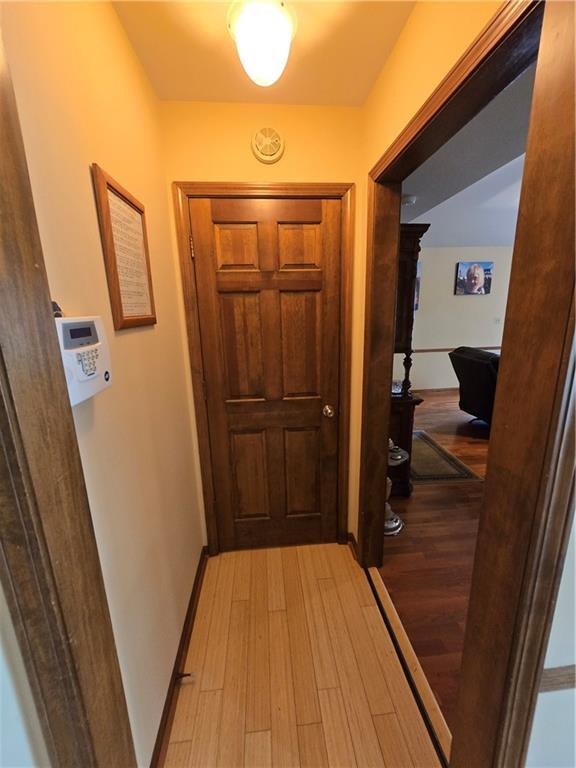 1502 Hillcrest Ct, Atchison, KS 66002 - hallway featuring light wood-type flooring and baseboards