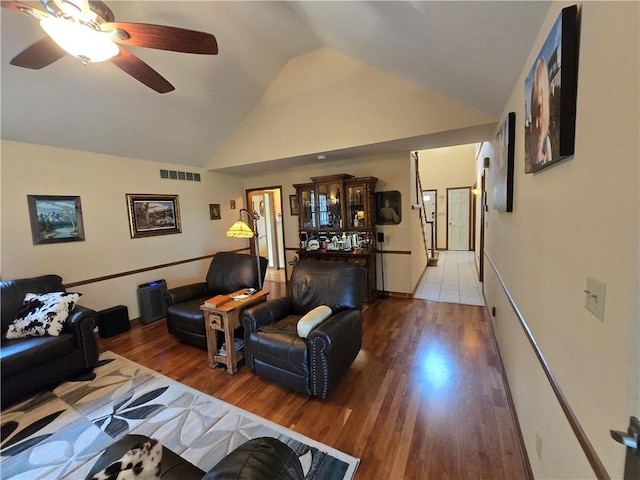 1502 Hillcrest Ct, Atchison, KS 66002 - living room featuring wood finished floors, a ceiling fan, and high vaulted ceiling