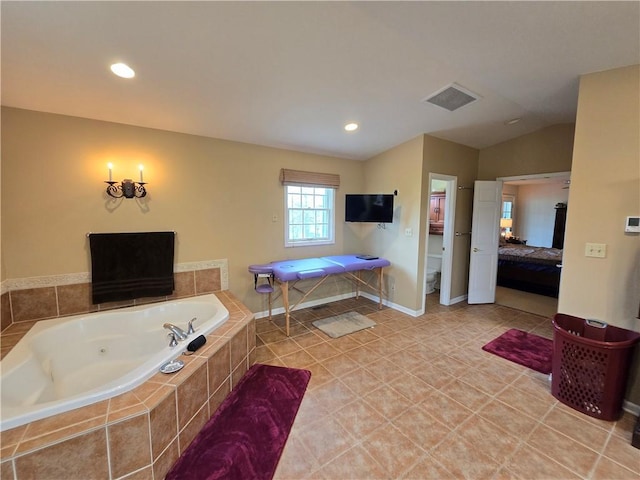 1502 Hillcrest Ct, Atchison, KS 66002 - full bath with toilet, a whirlpool tub, recessed lighting, connected bathroom, and vaulted ceiling
