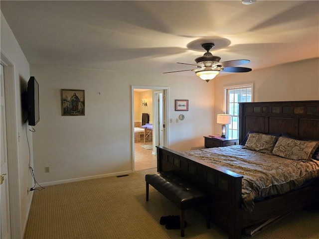1502 Hillcrest Ct, Atchison, KS 66002 - bedroom featuring light colored carpet, baseboards, and a ceiling fan