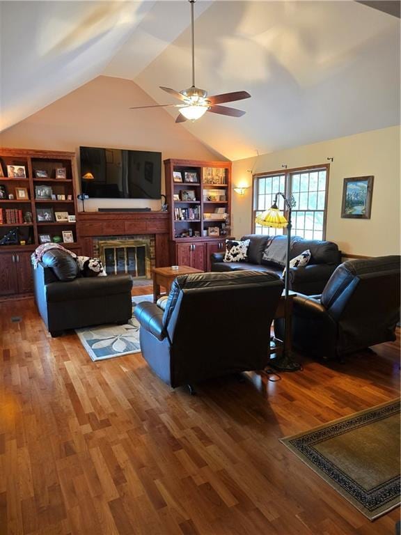 1502 Hillcrest Ct, Atchison, KS 66002 - living area with lofted ceiling, ceiling fan, wood finished floors, and a fireplace