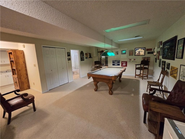 1502 Hillcrest Ct, Atchison, KS 66002 - recreation room with billiards table, a textured ceiling, carpet, and baseboards