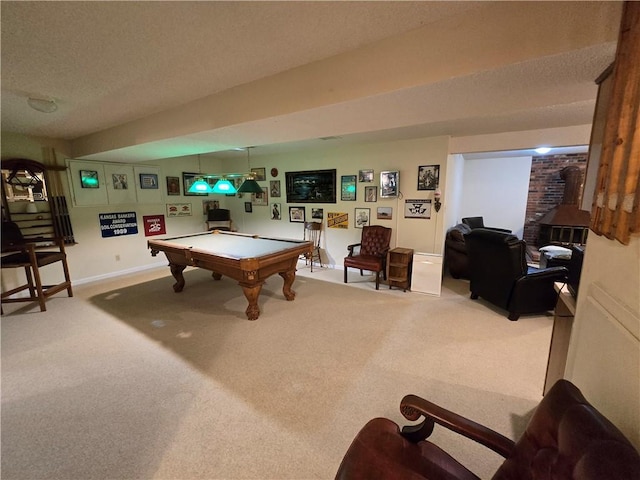 1502 Hillcrest Ct, Atchison, KS 66002 - rec room with carpet floors, billiards, a wood stove, a textured ceiling, and baseboards