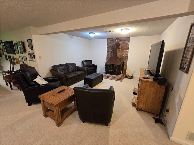 1502 Hillcrest Ct, Atchison, KS 66002 - living area featuring light colored carpet, a wood stove, and a textured ceiling