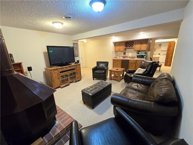 1502 Hillcrest Ct, Atchison, KS 66002 - carpeted living area with a textured ceiling and bar area
