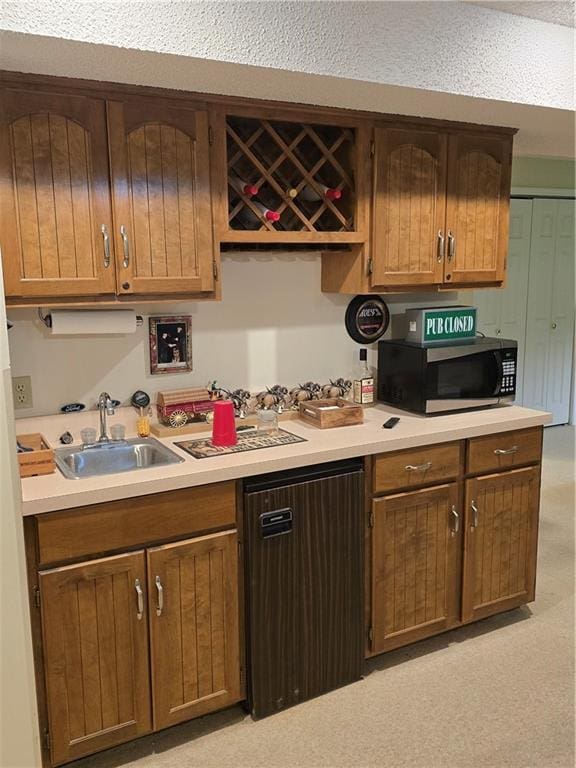 1502 Hillcrest Ct, Atchison, KS 66002 - kitchen featuring stainless steel microwave, a sink, and light countertops