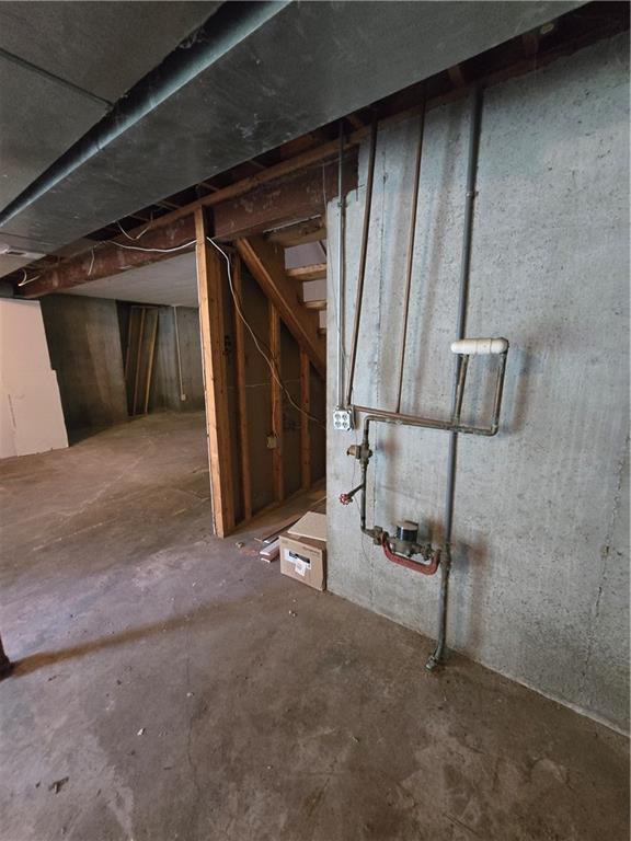 unfinished basement with stairway