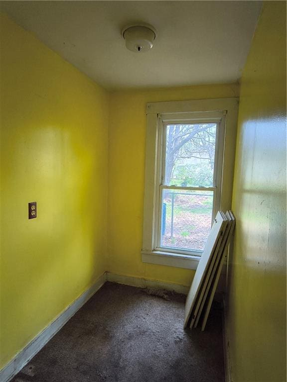 808 N Pine, Pittsburg, KS 66762 - unfurnished room with baseboards and dark carpet